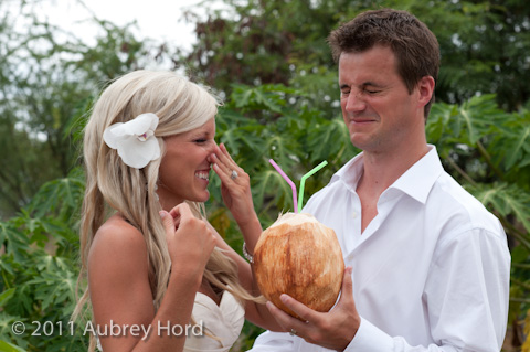 bride and groom reacting to fresh coconut juice